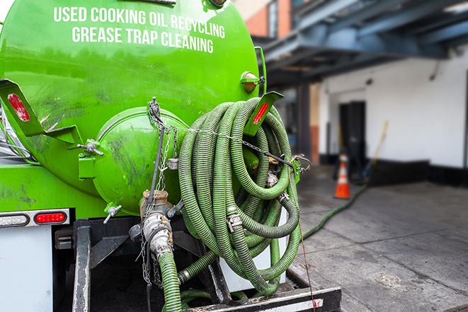 a pump truck emptying a grease trap in Aptos